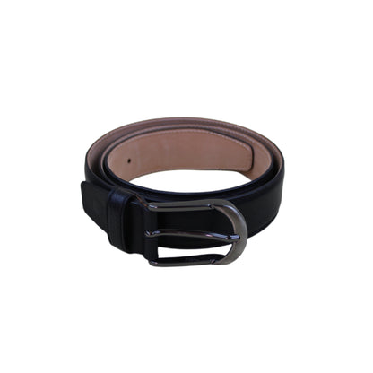Black leather belt with a brown lining on a white background